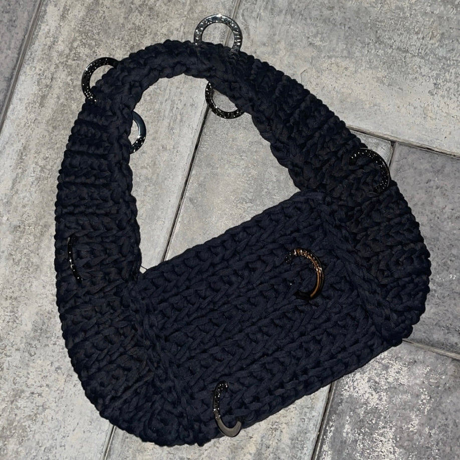 The pierced shoulder bag in black