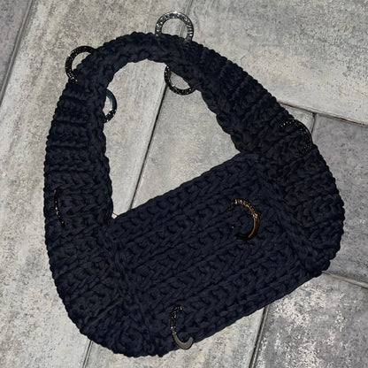 The pierced shoulder bag in black